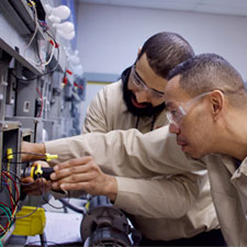 HVAC technicians troubleshooting a faulty system.