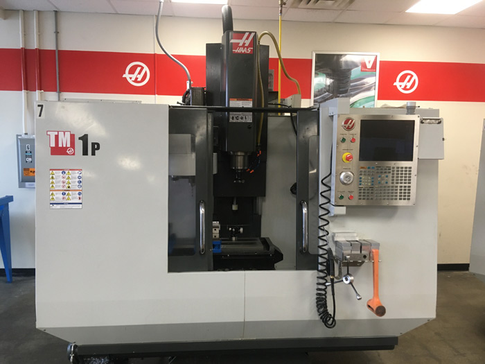 Haas Automation's TM1P is a 3 Axis Vertical Milling Center