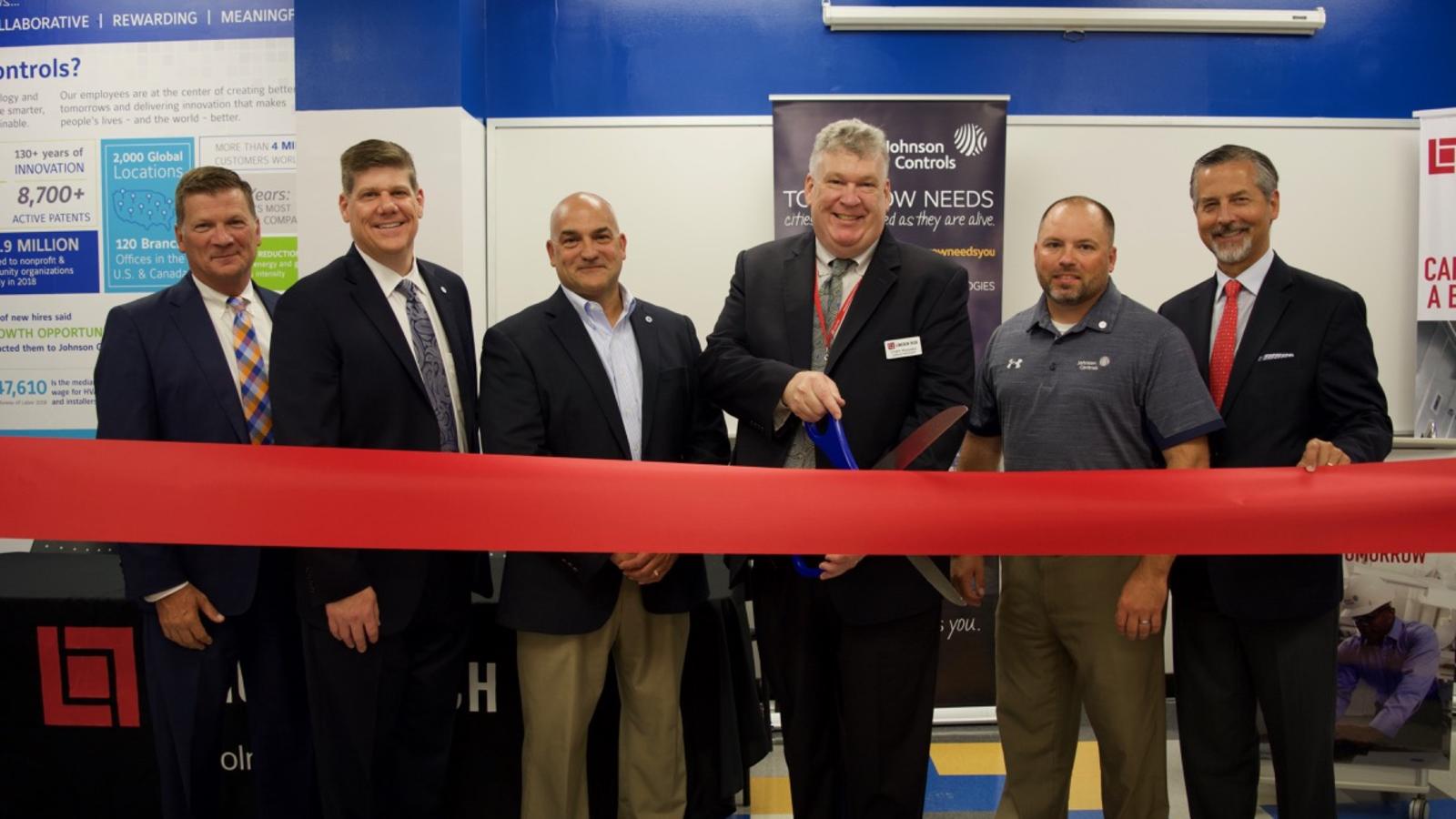 Johnson Controls Representatives and Lincoln Tech Staff cut the red ribbon