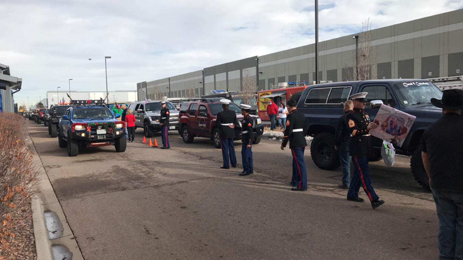 four-wheelers arrive at the Toys for tots center loaded with toys for children