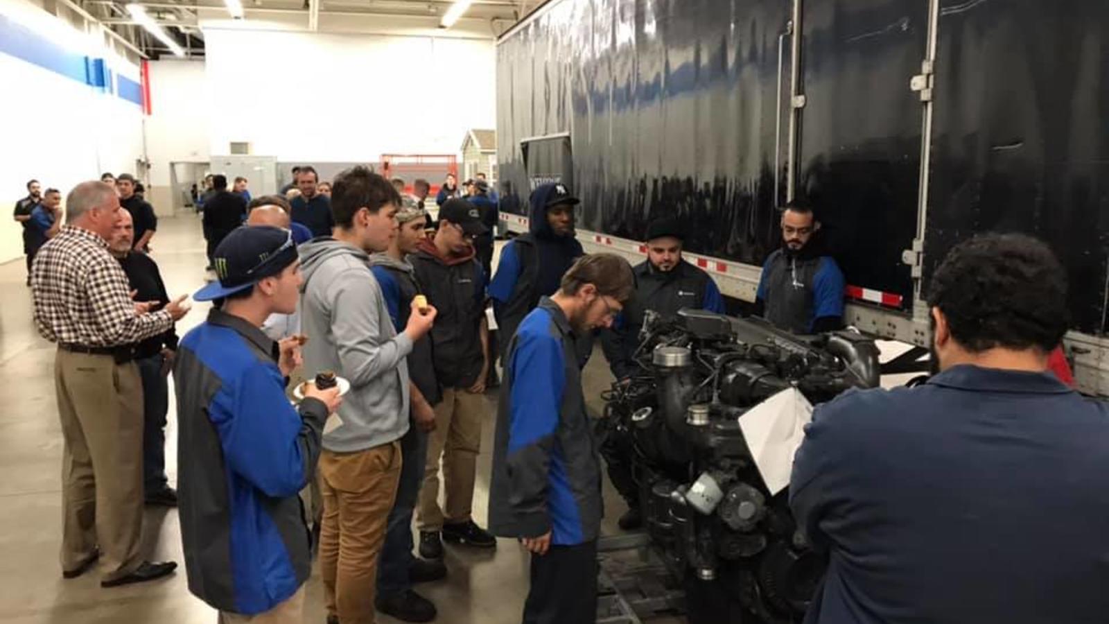 Diesel students take time to examine the latest arrival - a prized Paccar MX-13 engine.