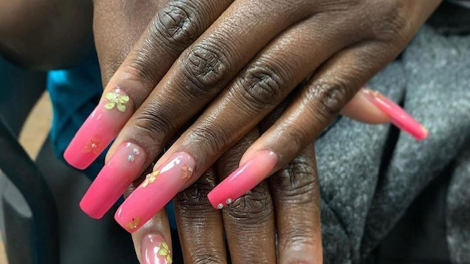 nail extensions with decorative art work.