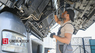 Diesel Mechanic maintaining a large truck.