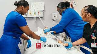 Practical nurse students training in a clinic environment.