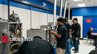Skilled trades students in a training lab.