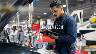 A mechanic in an auto repair shop.