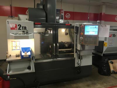 The VF2TR shown is a Haas Vertical Milling Center