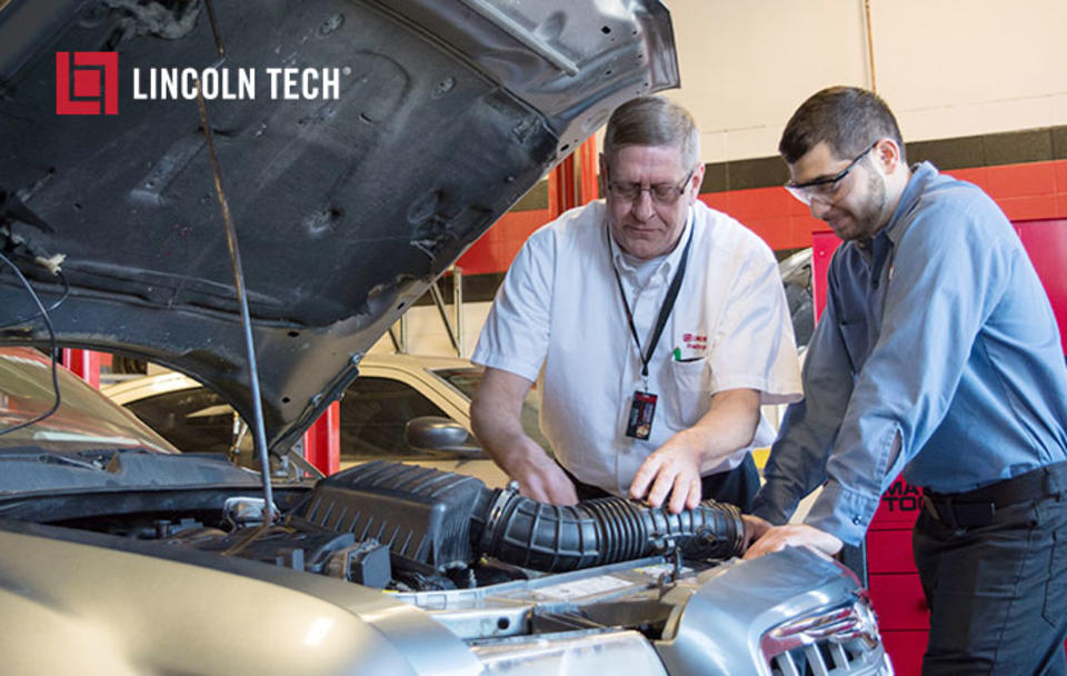Students work with an auto instructor at Lincoln Tech