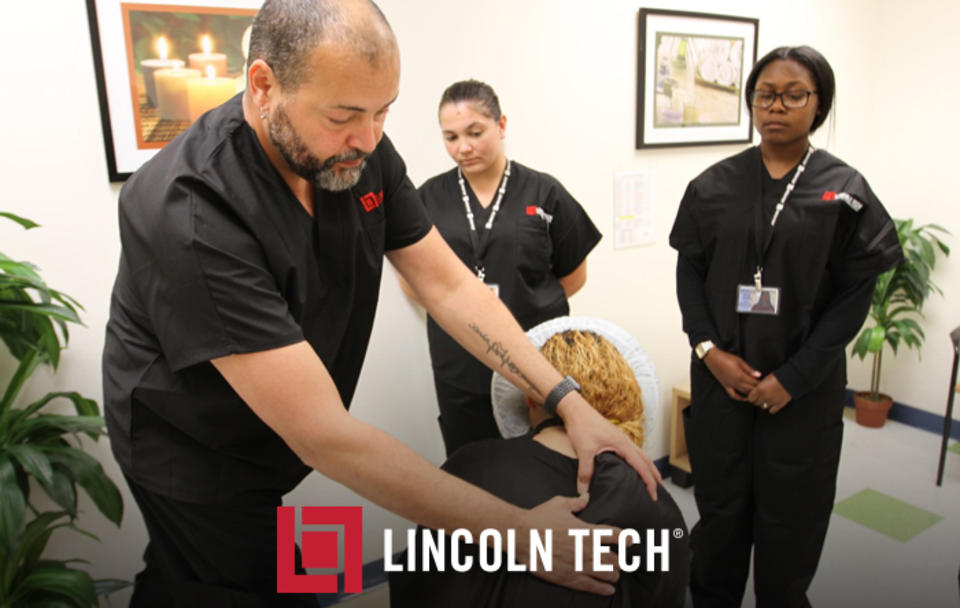 A Lincoln Tech Massage Therapy student practices newly-learned massage techniques
