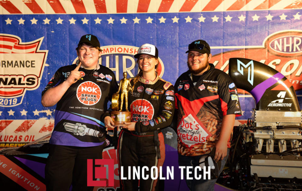 Lincoln Tech studenst John Lipscomb and Beau Fleming Flank Megan Meyer of Randy Meyer Racing at the US Nationals.