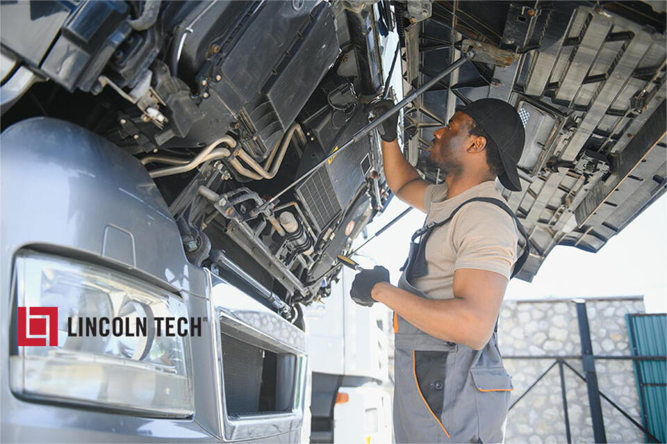 Diesel Mechanic maintaining a large truck.