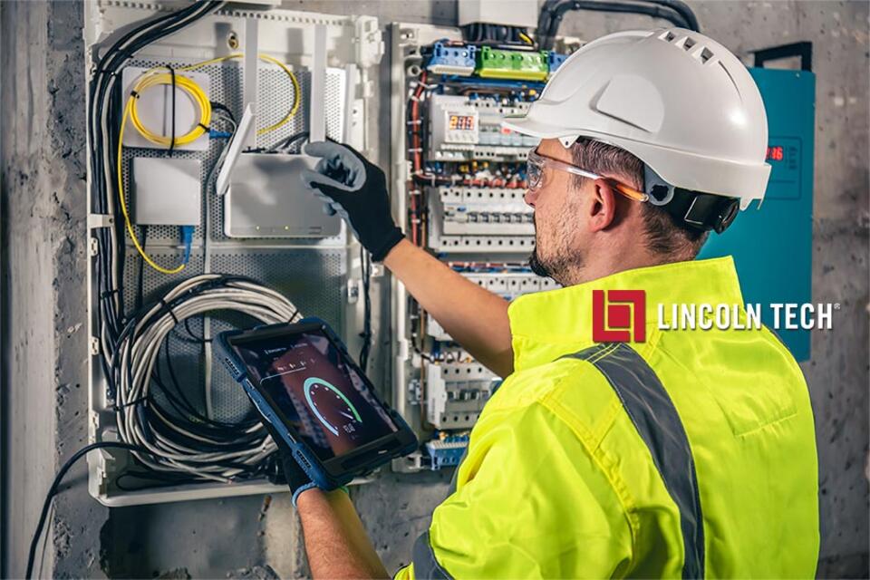An electrical technician works on a cable box in a smart home.
