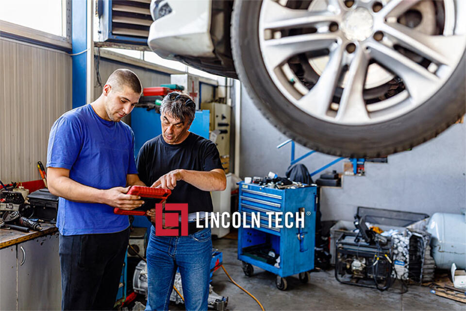 Two Philadelphia-based auto mechanics at work.