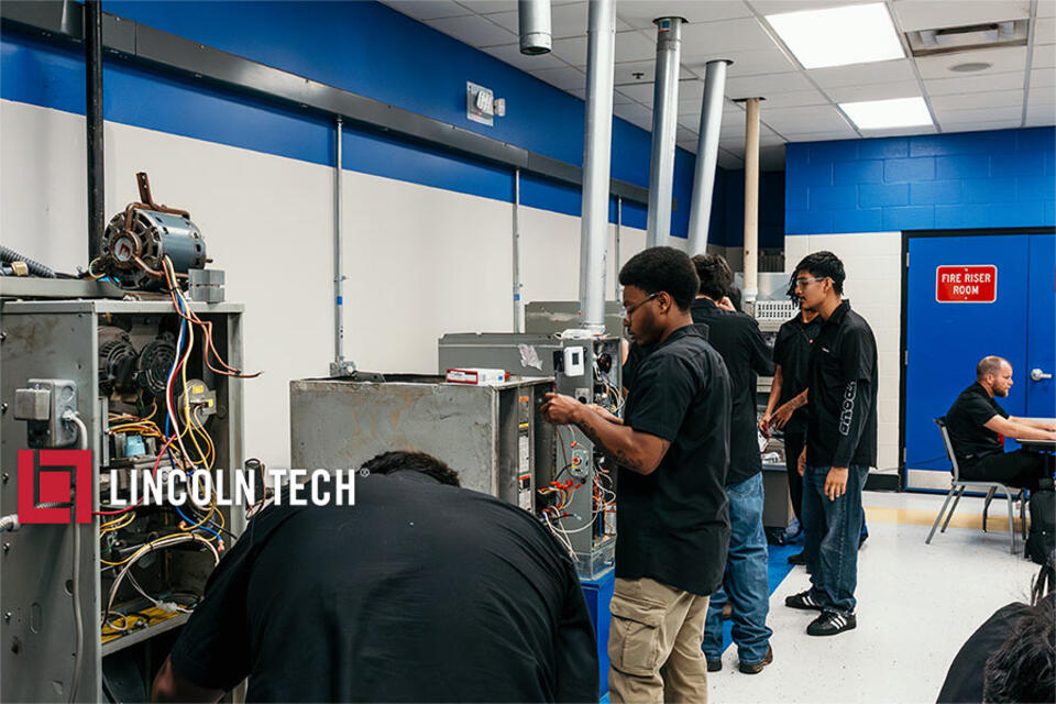 Skilled trades students in a training lab.